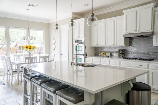 Interior of a white and chrome kitchen